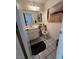 Clean bathroom featuring modern art, sink with cabinet, and tiled floor at 4662 Kelly Barry Way, Las Vegas, NV 89121