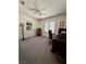 A bedroom with a desk, chair, bookshelf and window with shutter style blinds at 4662 Kelly Barry Way, Las Vegas, NV 89121