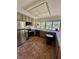 An eat-in kitchen with tile flooring and stainless steel appliances at 4662 Kelly Barry Way, Las Vegas, NV 89121