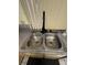 Double stainless steel sink with pull down faucet and window at 4662 Kelly Barry Way, Las Vegas, NV 89121