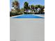 An outside view of the tennis court and the surrounding foliage at 4662 Kelly Barry Way, Las Vegas, NV 89121