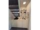 Compact wet bar area located beneath the staircase, perfect for entertaining at 4662 Kelly Barry Way, Las Vegas, NV 89121