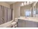 Bathroom with a shower-tub combo, and large mirror over a single sink vanity at 48 Verde Rosa Dr, Henderson, NV 89011