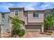 Charming two-story home featuring a well-maintained landscape and a two-car garage at 48 Verde Rosa Dr, Henderson, NV 89011