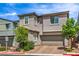 Charming two-story home featuring a well-maintained landscape and a two-car garage at 48 Verde Rosa Dr, Henderson, NV 89011