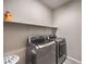 Convenient laundry room with stainless steel washer and dryer at 48 Verde Rosa Dr, Henderson, NV 89011