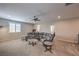 Second-floor living room featuring a comfortable sectional sofa and marble side tables at 48 Verde Rosa Dr, Henderson, NV 89011