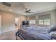 Comfortable main bedroom showcasing a large bed and an entertainment center at 48 Verde Rosa Dr, Henderson, NV 89011