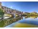 Scenic water view of bridge and buildings with reflections on the water on a clear day at 48 Verde Rosa Dr, Henderson, NV 89011