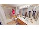 Functional bathroom featuring a bathtub with shower, vanity sink, and bright lighting at 50 Belle La Blanc Ave, Las Vegas, NV 89123