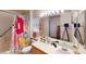 Inviting bathroom featuring colorful shower curtains, a sink and a toilet at 50 Belle La Blanc Ave, Las Vegas, NV 89123