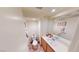 Practical bathroom with a single sink vanity, toilet, and mirrored wall decor at 50 Belle La Blanc Ave, Las Vegas, NV 89123