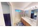 Well-lit bathroom featuring double sinks, a large mirror, and a shower-tub combination at 50 Belle La Blanc Ave, Las Vegas, NV 89123