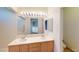 Bathroom with a double sink vanity, large mirror, and view into the bedroom at 50 Belle La Blanc Ave, Las Vegas, NV 89123