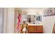Bright bathroom featuring a large mirror, decorative shower curtain, and a single sink vanity at 50 Belle La Blanc Ave, Las Vegas, NV 89123