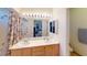 Double sink bathroom with a shower and a large mirror with modern lighting at 50 Belle La Blanc Ave, Las Vegas, NV 89123