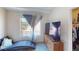 Comfortable bedroom with a sitting area next to a window, dresser and large walk-in closet at 50 Belle La Blanc Ave, Las Vegas, NV 89123