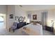 Bright bedroom featuring a floral headboard, a mirrored dresser, and plush gray carpeting at 50 Belle La Blanc Ave, Las Vegas, NV 89123