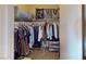 Walk-in closet, equipped with ample hanging space, storage shelves, and bags at 50 Belle La Blanc Ave, Las Vegas, NV 89123