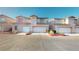 Charming two-story townhouse featuring a one-car garage and well-maintained landscaping at 50 Belle La Blanc Ave, Las Vegas, NV 89123