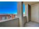 Private balcony overlooking neighboring buildings with bright blue sky for a clean, airy vibe at 50 E Serene Ave # 420, Las Vegas, NV 89123