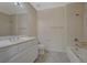 This bathroom offers double sinks, a standard shower-tub, and neutral tiled flooring at 50 E Serene Ave # 420, Las Vegas, NV 89123