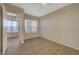 Bedroom featuring wood-look floors and plenty of natural light at 50 E Serene Ave # 420, Las Vegas, NV 89123
