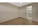 Bedroom featuring wood-look flooring, neutral walls, and doorway to walk-in closet at 50 E Serene Ave # 420, Las Vegas, NV 89123