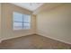 A bright bedroom offers light colored walls, a window and wood vinyl flooring at 50 E Serene Ave # 420, Las Vegas, NV 89123