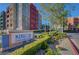 Manhattan Condominiums features colorful buildings, manicured landscaping, and clear signage at 50 E Serene Ave # 420, Las Vegas, NV 89123