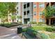 Well-maintained complex featuring landscaped grounds with seating and a path to building entrance at 50 E Serene Ave # 420, Las Vegas, NV 89123
