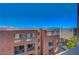 View of a modern apartment building with large balconies against a clear blue sky at 50 E Serene Ave # 420, Las Vegas, NV 89123