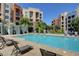 Large community pool with sun loungers provides a resort-style living experience at 50 E Serene Ave # 420, Las Vegas, NV 89123