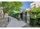 Walkway to the pool area has lush shrubs and well-maintained landscaping at 50 E Serene Ave # 420, Las Vegas, NV 89123