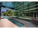 Relaxing pool area featuring sun loungers, a spa, and sleek, modern architecture at 50 E Serene Ave # 420, Las Vegas, NV 89123