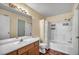 Functional bathroom with a bathtub-shower combo and wood vanity, offering essential amenities and classic design at 5024 Starfinder Ave, Las Vegas, NV 89108