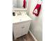 Bathroom featuring a vanity with a white countertop and a decorative red towel at 5024 Starfinder Ave, Las Vegas, NV 89108