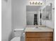 Simple bathroom features a single-sink vanity, toilet, and a bathtub-shower combo, offering basic functionality at 5024 Starfinder Ave, Las Vegas, NV 89108