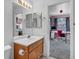 Comfortable bathroom complemented by a view into a bedroom with an office space, offering functionality at 5024 Starfinder Ave, Las Vegas, NV 89108