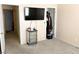 Bedroom with TV, closet, and neutral carpeting at 5024 Starfinder Ave, Las Vegas, NV 89108