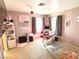 Bedroom with carpet floors, two windows, and decorative walls at 5024 Starfinder Ave, Las Vegas, NV 89108