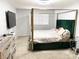Bedroom with a plush queen-sized bed, TV, and carpeted floor at 5024 Starfinder Ave, Las Vegas, NV 89108