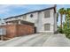 Two-story home with desert landscaping, a covered carport, and a spacious driveway at 5024 Starfinder Ave, Las Vegas, NV 89108