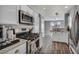 Well-lit kitchen featuring stainless steel appliances, granite countertops, and plenty of cabinet space at 5024 Starfinder Ave, Las Vegas, NV 89108