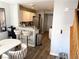 Open concept kitchen featuring updated cabinets, stainless appliances, and breakfast bar with stool seating at 5024 Starfinder Ave, Las Vegas, NV 89108
