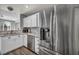 Kitchen featuring a stainless steel refrigerator and a view of the sink and dishwasher at 5024 Starfinder Ave, Las Vegas, NV 89108