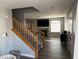 Open living room with staircase, hardwood floors, and natural light at 5024 Starfinder Ave, Las Vegas, NV 89108