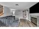 Living room featuring a fireplace, TV, and built-in shelves, with a sectional sofa at 5024 Starfinder Ave, Las Vegas, NV 89108