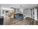 Spacious living room with staircase, bookshelf, and dining area visible in the background at 5024 Starfinder Ave, Las Vegas, NV 89108
