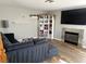 Inviting living room featuring a fireplace, stylish bookshelf, and comfortable seating area at 5024 Starfinder Ave, Las Vegas, NV 89108
